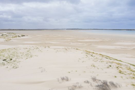 Aerial view of sand dunes at the mouth of the River Murray in regional South Australia in Australia