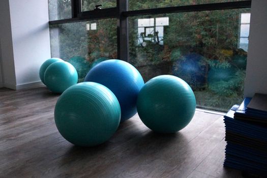 fitness balls by the window in the gym close-up