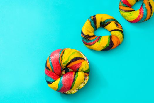 Colorful bagel on blue background