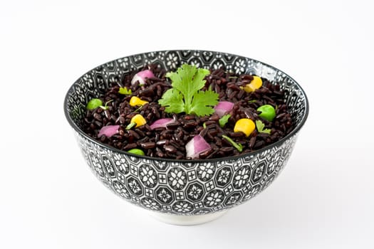 Black rice and vegetables isolated on white background