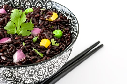 Black rice and vegetables isolated on white background