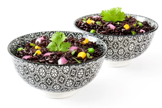 Black rice and vegetables isolated on white background