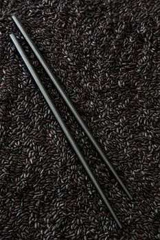 Black chopstick black rice background