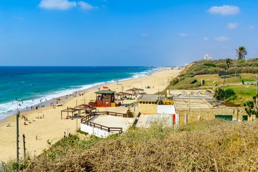 Ashkelon, Israel - August 12, 2020: View of the Mediterranean beach of Ashkelon National Park, with visitors. Southern Israel