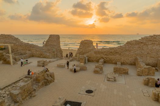 Ashdod, Israel - August 12, 2020: Sunset view of the remains of Ashdod Citadel (Ashdod Yam or Ashdod on the Sea), with visitors. Southern Israel