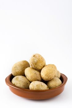 Canarian potatoes (papas arrugadas) isolated on white background