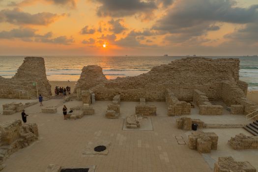 Ashdod, Israel - August 12, 2020: Sunset view of the remains of Ashdod Citadel (Ashdod Yam or Ashdod on the Sea), with visitors. Southern Israel