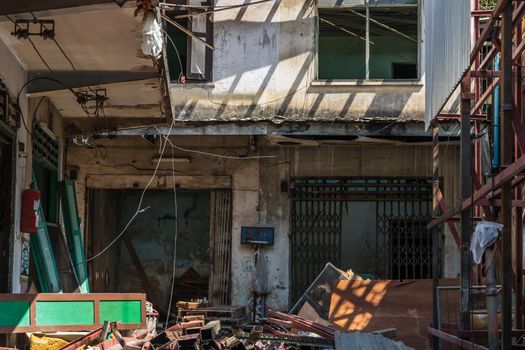 External of old house was left to deteriorate over time, Chinese Architecture style, Abandoned house, Destroyed house, Ruined house, Selective focus.