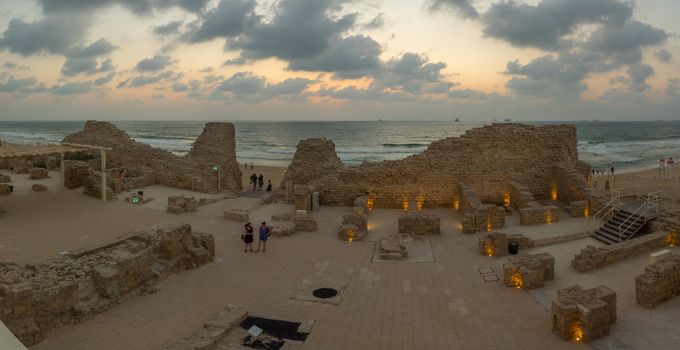 Ashdod, Israel - August 12, 2020: Sunset view of the remains of Ashdod Citadel (Ashdod Yam or Ashdod on the Sea), with visitors. Southern Israel