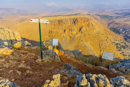 Arbel, Israel - August 14, 2020: View landscape and Mount Nitay from Mount Arbel National Park, with explanation signs. Northern Israel