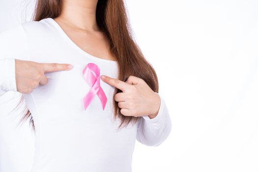 Breast cancer awareness ribbon on woman chest isolated over white background. Medical, healthcare for advertising concept.