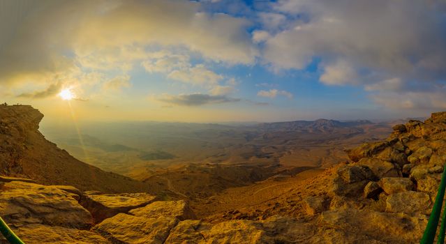 Panoramic sunrise view of cliffs and landscape in Makhtesh (crater) Ramon, the Negev Desert, Southern Israel