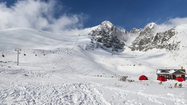 Lomnicky stit peak winter panorama. Skalnate sedlo ski resort, Slovakia