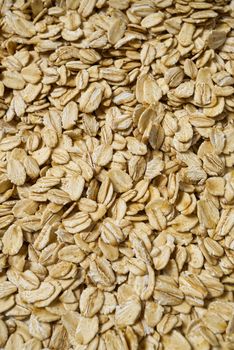 organic healthy pile of dry oat flakes, texture background