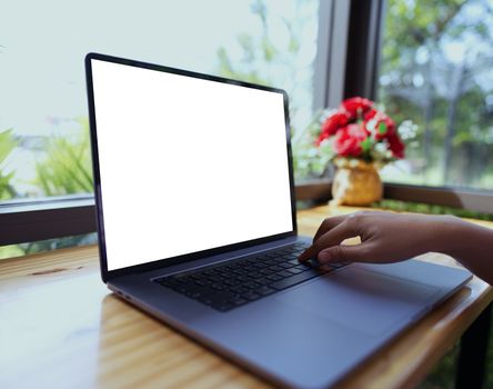 Teenage woman hand using Tablet PC with white screen separate copy space Selective focus.