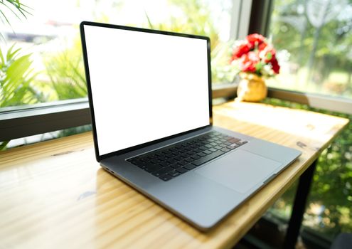 The laptop was placed on the table at the coffee shop.