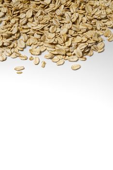 the organic healthy raw oat flakes on white background with copy space border