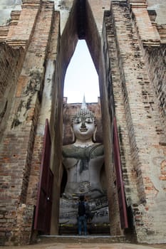 Sri Chum Temple is an ancient monument in the Sukhothai Historical Park. This temple is enshrined by the large Buddha, which is called "Phra Ajarna".  : Sukhothai,Thailand - JULY,01,2018