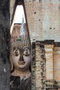 Sri Chum Temple is an ancient monument in the Sukhothai Historical Park. This temple is enshrined by the large Buddha, which is called "Phra Ajarna".  : Sukhothai,Thailand - JULY,01,2018