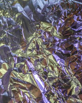 Detailed close up texture of an aluminum foil surface in different colors