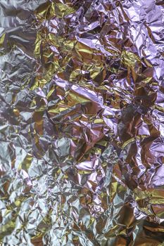 Detailed close up texture of an aluminum foil surface in different colors