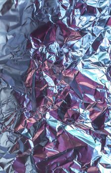 Detailed close up texture of an aluminum foil surface in different colors