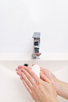antibacterial soap in the hands. soapy hands. Wash hands with soap and water. Coronavirus Prevention, COVID-19, The concept of virus protection during the coronavirus epidemic
