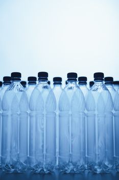 empty plastic bottle silhouettes on blue background