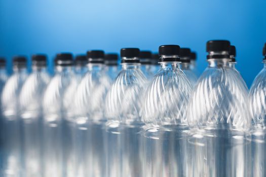 empty plastic bottles on blue background