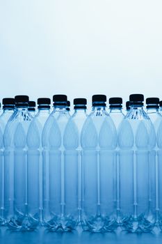 empty plastic bottle silhouettes on blue background