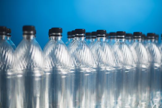 empty plastic bottles on blue background