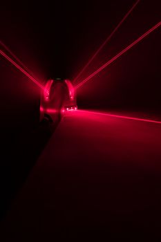 laser level tool red light beams on black