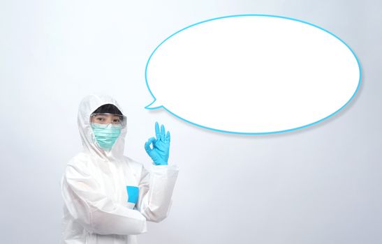 Woman doctor in PPE or personal protection equipment suit and medical mask and glove for protect corona virus or covid-19 and studio shot on white background and copy space