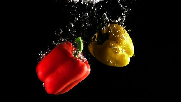 Colorful freshness fruit falling in to water splash and black background