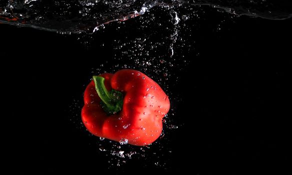 Colorful freshness fruit falling in to water splash and black background