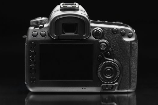 dslr photo camera body on black background