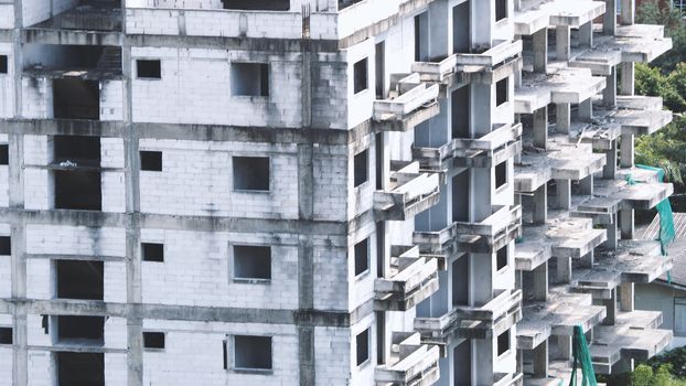 Blurred images of abandoned old dirty building or tower which unfinished construction because of no budget.