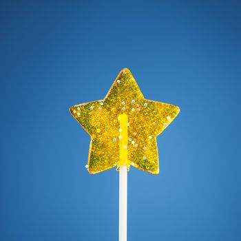 yellow star candy, blue background