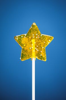 yellow star candy, blue background
