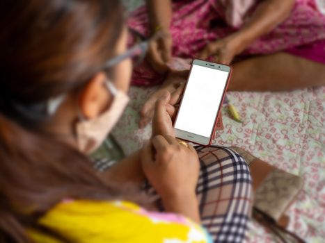 An asian woman using a smart phone. mock up screen concept.