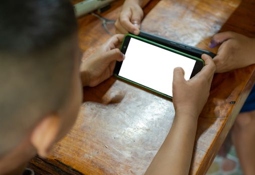 Boy using the smartphone. mockup screen concept.