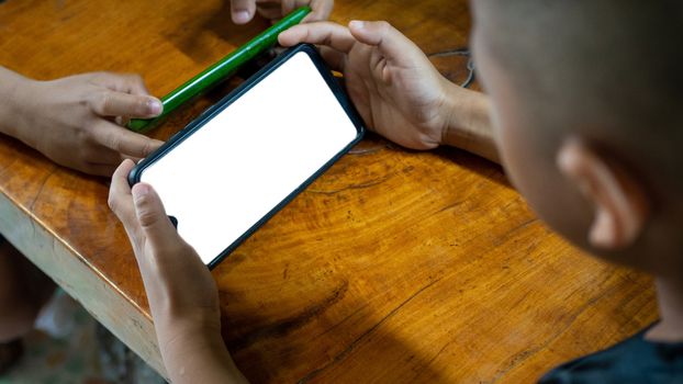 Boy using the smartphone. mockup screen concept.