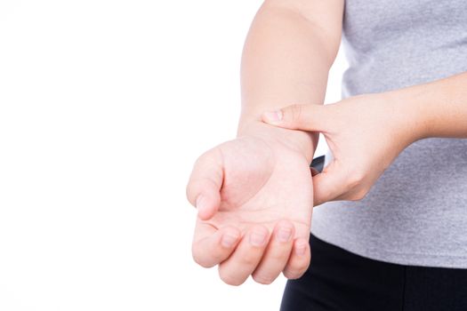 Young woman suffering from wrist pain isolated on over white background. Healthcare medical or daily life concept.