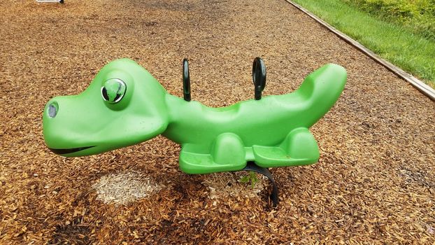 wet green playground equipment or play structure ride at park