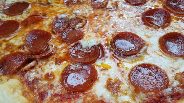 hot pepperoni meat and greasy cheese pizza slices