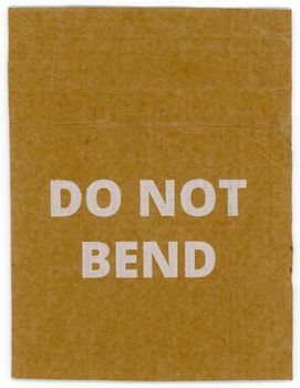 do not bend written on brown corrugated cardboard packet