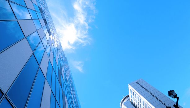 Low angle view images of office hotel and department store modern style building in Sapporo Hokkaido Japan on summer season day with blue clear sky and white cloud.