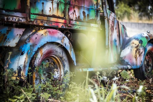 The wreckage of a truck painted with bright colors