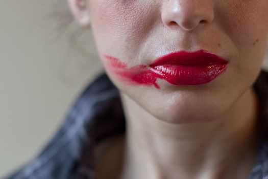 Wrong makeup, smudged lipstick.
