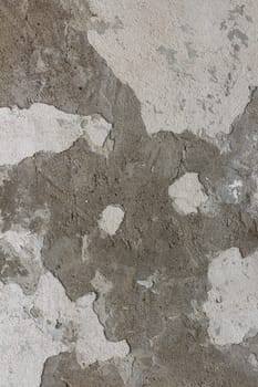 A terrible figure seems to emerge from the wall.